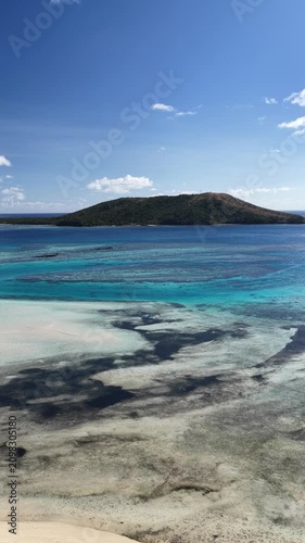 Vertical drone view of a coral reef and island, Oarsmans Bay, Fiji