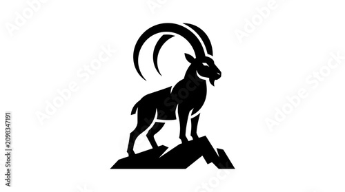 Принти на полотні Silhouette of a majestic ibex standing on rocks.