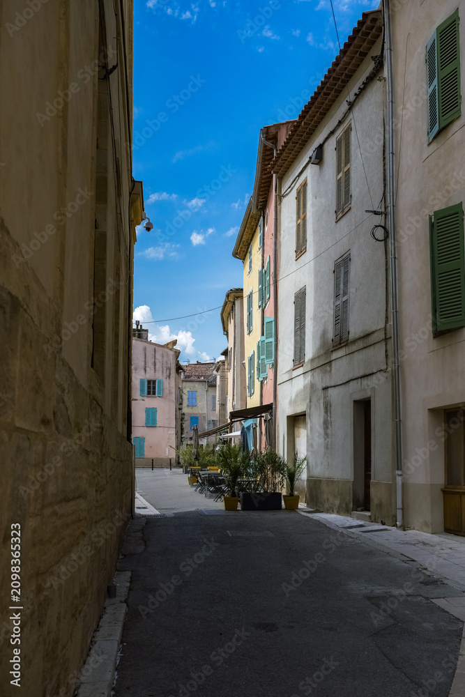Fototapeta premium Saint-Maximin-la-Sainte-Beaume, typical houses, colorful buildings in the historic center 