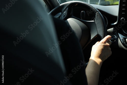 Foto Driver grips steering wheel while approaching gas station