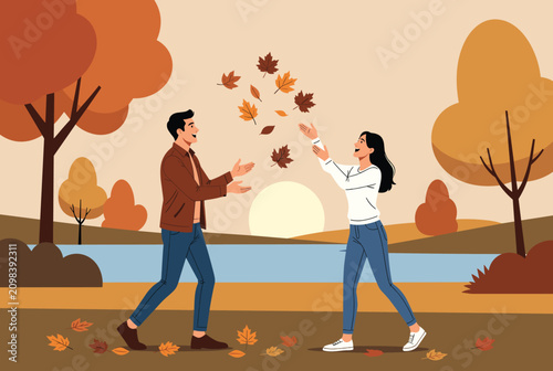 Happy young couple enjoying a beautiful autumn day in the park by throwing colorful falling leaves into the air at sunset.