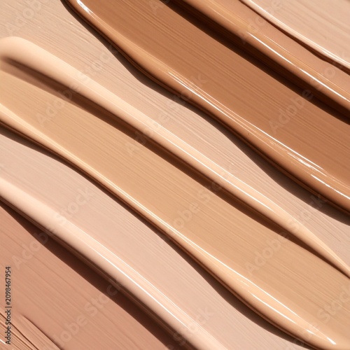 Liquid beauty foundation swatches in diverse skin tones showing smooth cosmetic texture