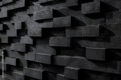 Charcoal Block Wall with Repeating Geometry and Hard Directional Light Creates Bold Modern Texture Background