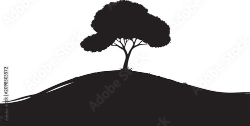 Foto Silhouette tree on a hillside landscape