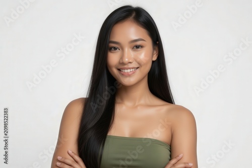 Smiling Young Asian Woman in Green Strapless Top Beauty Portrait for Skincare and Wellness