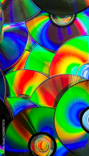 Reflection of the surface of a DVD discs with artistic lighting close-up