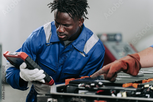 Electric Vehicle Battery Maintenance and Diagnostics by Auto Technician