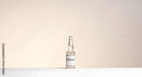 Single cosmetic vial bottle on clean white laboratory background.