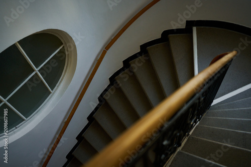 Photos spiral staircase with a wooden banister