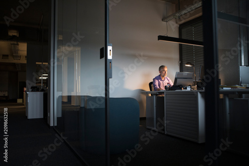 Businessman working late in office