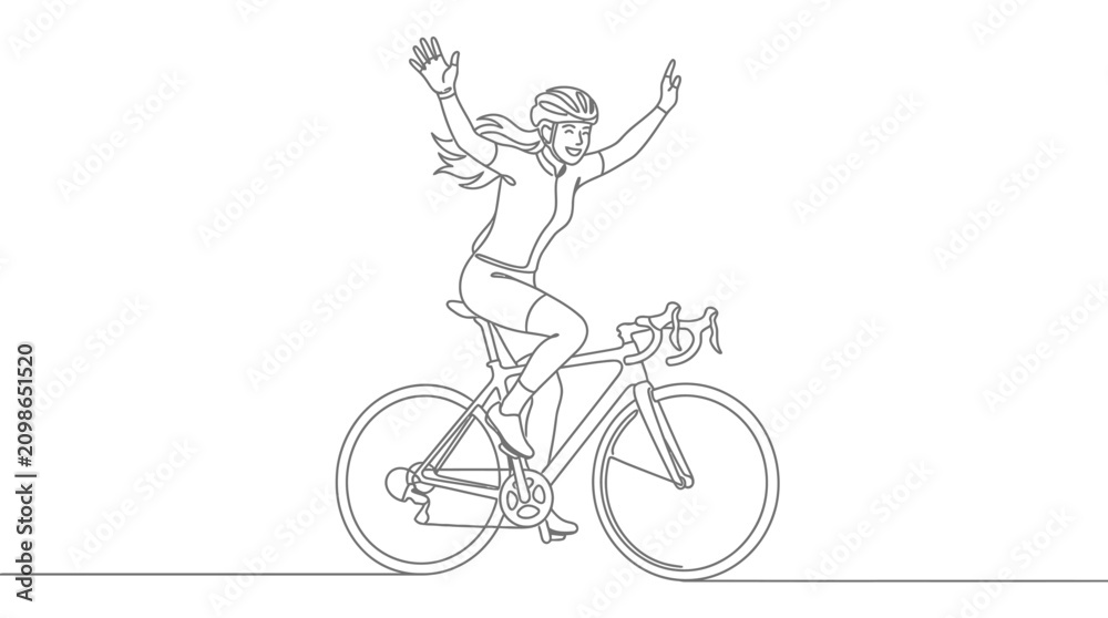 Fototapeta premium Cyclist celebrating victory with arms raised in triumph on a bicycle