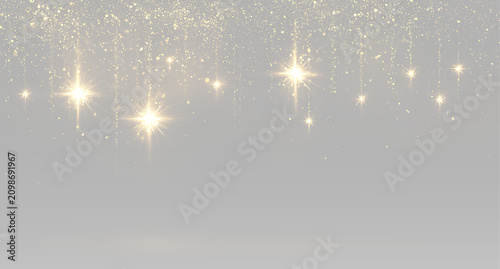 Obraz na płótnie Golden glitter rain hanging glitter stars sparkling gold dust luxury festive Chr