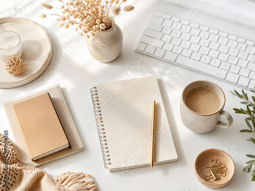 Fotografía Cozy minimal workspace with notebook keyboard and coffee