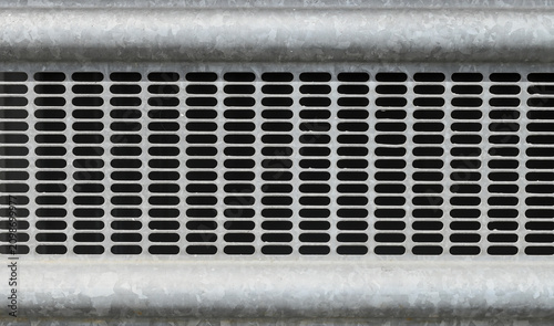Fotografie Close up of galvanized metal ventilation grille with perforated pattern, industrial texture and geometric symmetry