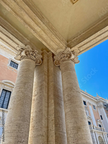 Fotografie Classic Roman architecture with travertine columns and ornate Baroque details