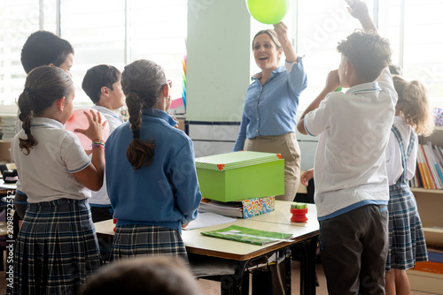Elementary school teacher leading a classroom science experiment