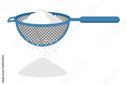 Fotografie A blue kitchen sieve is used to sift fine white powder into a neat pile