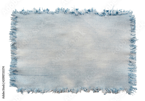 Piece of torn denim on a white background. Denim texture