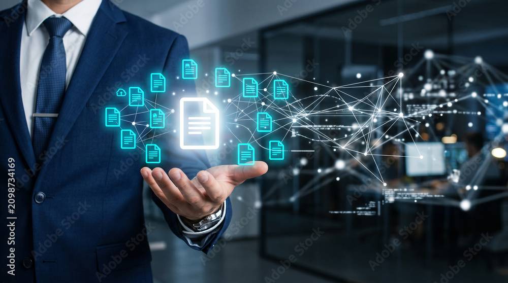 Obraz premium Businessman holding glowing document icons linked in a network, representing data management, digital transformation, and cloud connectivity concepts