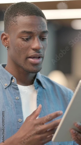 Video Call on Tablet by African Man, Vertical Video
