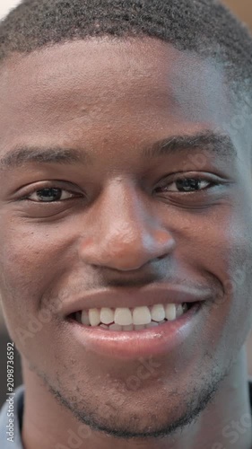 Face of African Man Smiling at the Camera, Vertical Video