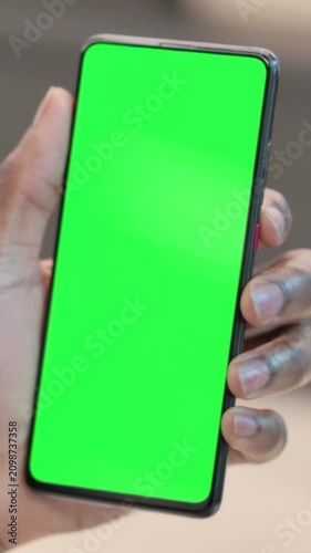 African Man using Smartphone with Green Chroma Key Screen, Vertical Video