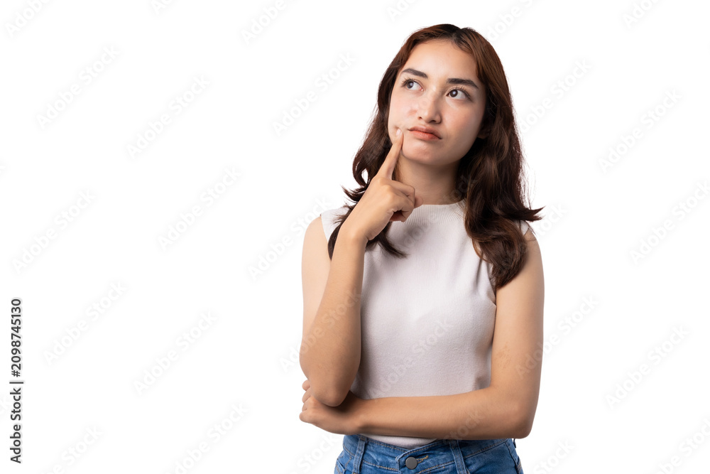 Naklejka premium Thoughtful young Asian woman pointing to cheek while looking up with copy space on transparent background