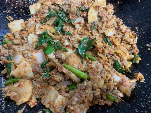 The Thai dish is called Stir-fried Pickled Bamboo Shoots with Minced Pork.