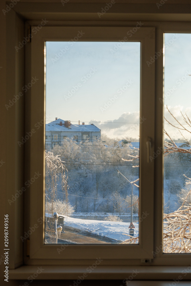 Obraz premium Winter view through window on snowy morning