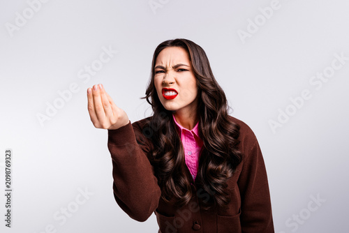 Konstfotografi Confident businesswoman expressing strong opinion in casual attire on a white ba