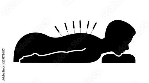 Black silhouette of a person lying down with acupuncture needles inserted