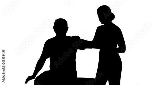 Silhouette of a woman assisting a seated man in a vector graphic illustration showing support and care between two people in a simple design