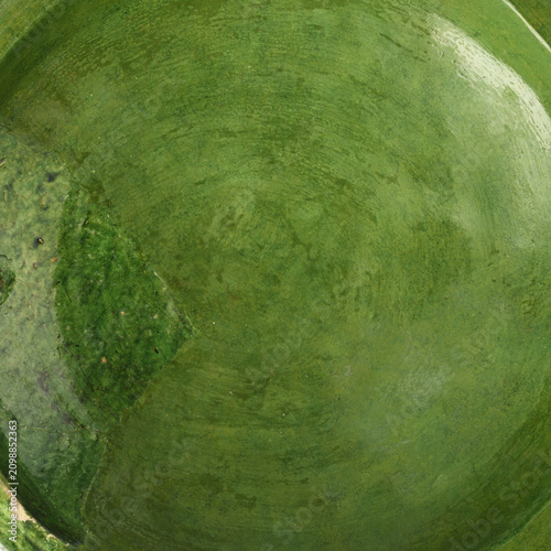 Surface of ceramic glazed tableware of dark green color