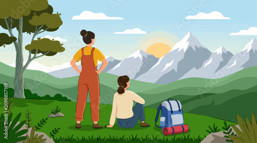 Two women hikers admiring a scenic mountain landscape at sunrise
