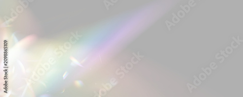 PNG. Rainbow crystal shine with radiant optical highlights. Soft colorful rays spread through the scene. Transparent bokeh creates a magical atmosphere.