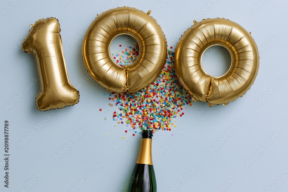 Fototapeta premium The Golden Hundred Balloons Celebration with Champagne Bottle and Confetti