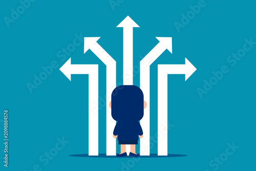 Back view of thoughtful young businesswoman with two pointers on concrete background, deciding which way to go. Decision and way concept.