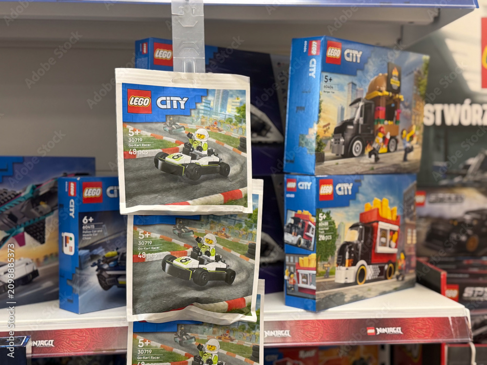 Obraz premium Toy building set boxes and hanging cards displayed on a store shelf in a retail aisle