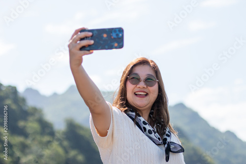 woman taking selfie photo in beautiful landscape. selfie. beauty.
