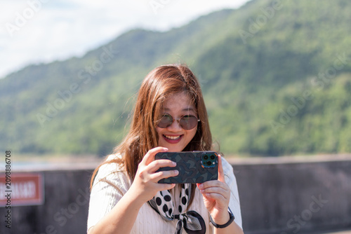woman taking selfie photo in beautiful landscape. selfie. beauty.