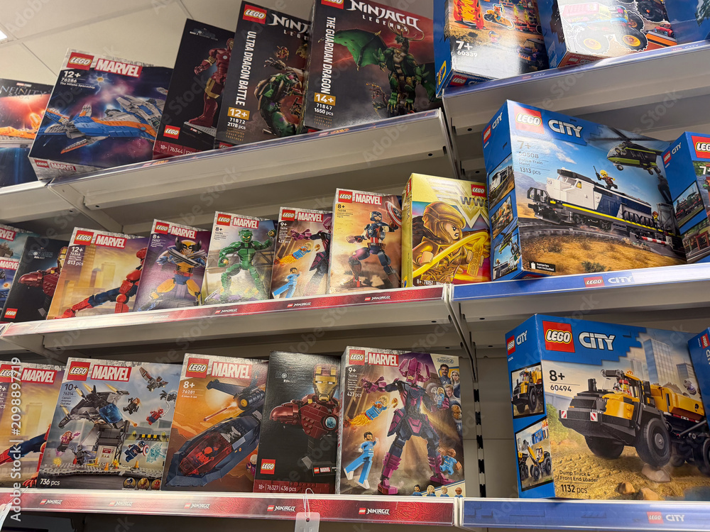 Fototapeta premium Shelves of lego toy boxes in a retail store aisle
