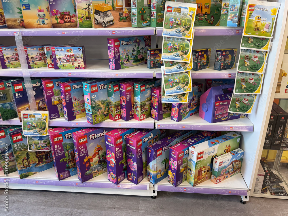 Fototapeta premium Retail store shelf filled with colorful lego friends toy boxes on display