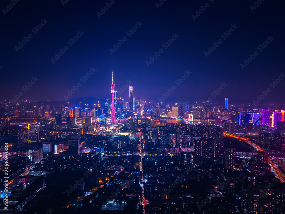 Obraz premium Stunning aerial night view of Guangzhou cityscape illuminated by vibrant neon lights, future of China