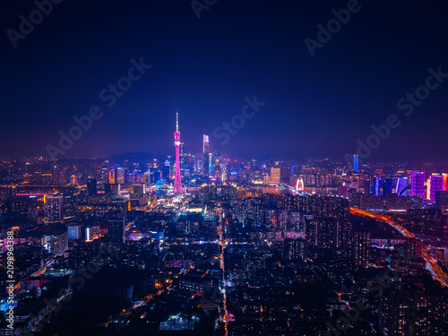 Quadro su tela Stunning aerial night view of Guangzhou cityscape illuminated by vibrant neon li