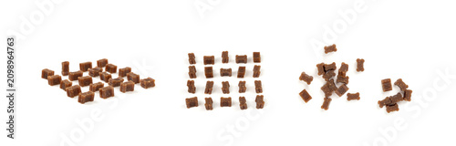 Fotografía Mini bone-shaped pet food, small dogs crunchy treats, flavored brown dry kibble,
