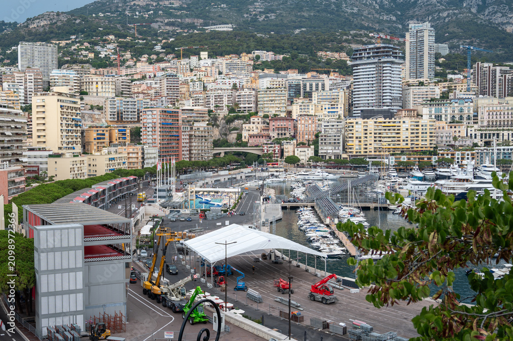 Obraz premium Exclusive real estate development and luxury hillside residential apartments overlooking Port Hercules in Monte Carlo, Monaco