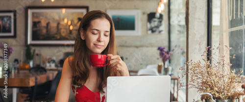 Photos Banner Asian Woman drink black coffee hand holding cup at green garden cafe