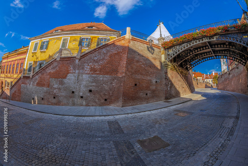 SIBIU, ROMANIA - JULY 8, 2020: View to the Bridge of Lies, the first cast iron bridge built in Romania and the second one built in Europe.
Traverses Street Ocnei to connect the Lesser and Huet Square.