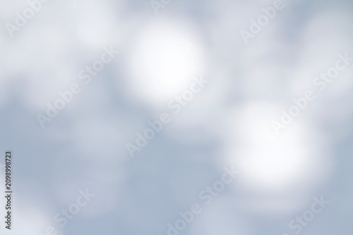 Soft abstract shadow of tree leaves cast on a white surface in the morning light. Natural organic pattern with gentle blur and calm atmosphere