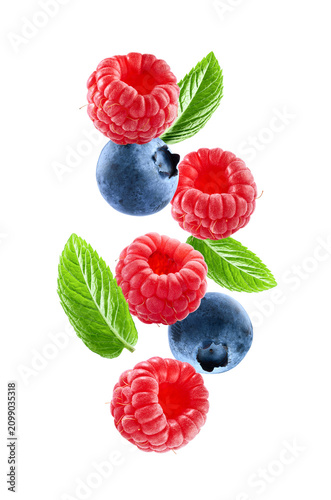 Levitate mix berries with mint leaves on white background